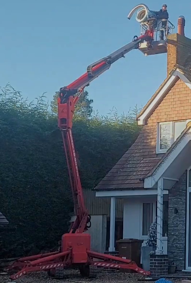 Chimney Liner Installation, In eakring, Nottingham Chimney Liner being installed by Danny Iwanejko using his tracked spider cherrypicker in Eakring, Nottinghamshire